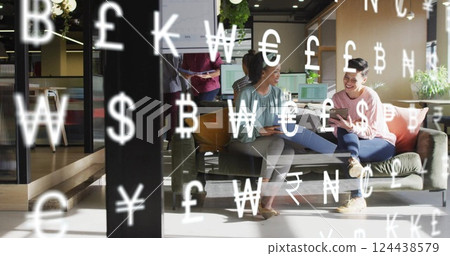 Image of currency symbols and data processing over diverse business people in office 124438579