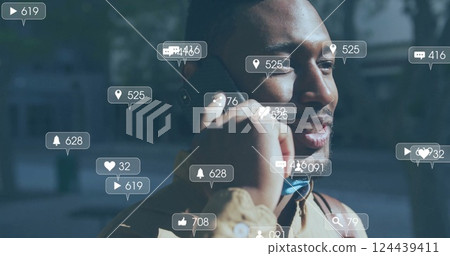 Image of social media notifications over happy african american man talking on smartphone 124439411