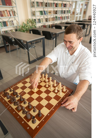 Portrait Caucasian man playing chess. Portrait Caucasian man playing chess. 124440927