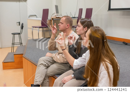 Students learn sign language at university. Students learn sign language at university. 124441241