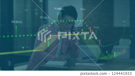 Analyzing financial data and talking on phone, businessperson over stock market image 124441933