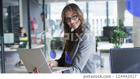 Image of data processing and diagrams over caucasian casual businesswoman using laptop 124442017