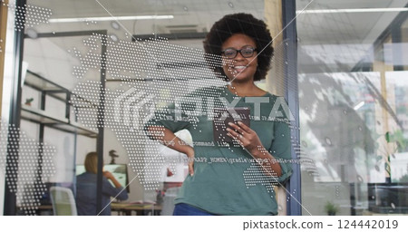 Image of data processing and world map over biracial casual businesswoman using tablet Image of data processing and world map over biracial casual businesswoman using tablet 124442019