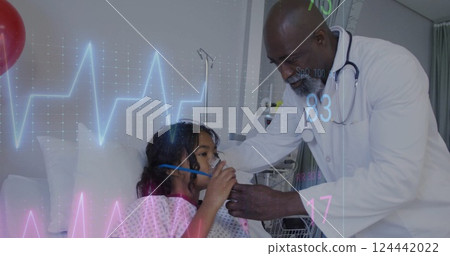 Image of cardiograph over diverse male doctor and girl patient in hospital Image of cardiograph over diverse male doctor and girl patient in hospital 124442022