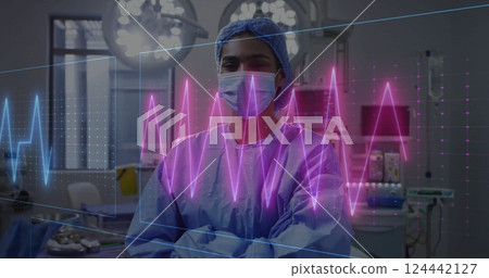 Image of cardiograph over biracial female surgeon in operating room 124442127
