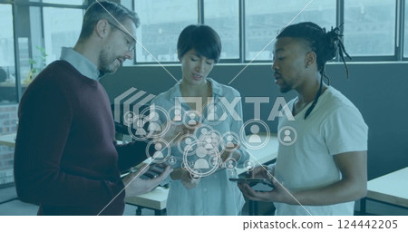 Image of people icons and data processing over diverse business people in office Image of people icons and data processing over diverse business people in office 124442205