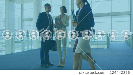 Image of people icons and data processing over diverse business people in office Image of people icons and data processing over diverse business people in office 124442226