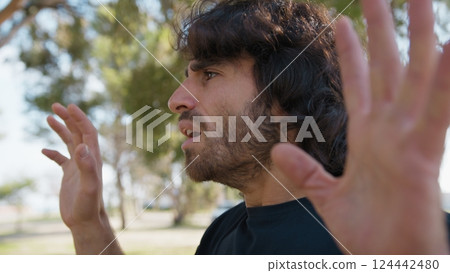 Scared Boy Raises His Hands Before Receiving Theft From A Criminal In a Park Scared Boy Raises His Hands Before Receiving Theft From A Criminal In a Park 124442480