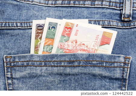 Cuban convertible pesos in the pocket of blue jeans 124442522