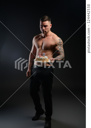 Celebrating a fitness birthday with a cake and tattoos in the spotlight 124442538