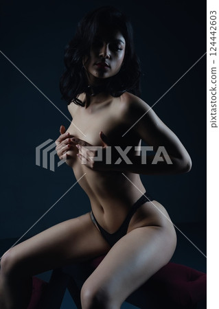 Woman Posing in Black Lingerie prepared for bdsm game 124442603