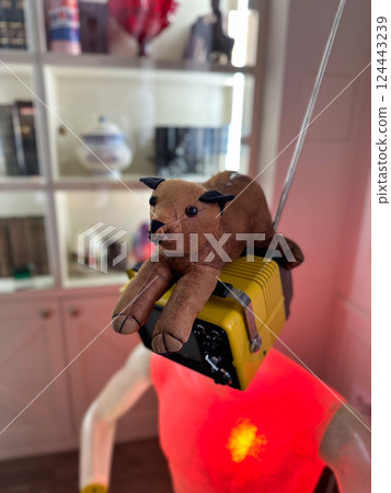 Soft cat toy on camera head installation with glowing chest. Surreal art, symbolism, and emotional visual storytelling. Soft cat toy on camera head installation with glowing chest. Surreal art, symbolism, and emotional visual storytelling. 124443239