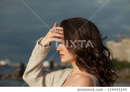 Attractive brunette woman 30 s years old resting outdoors Attractive brunette woman 30 s years old resting outdoors 124443244