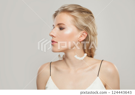 Glamorous blond model woman portrait. Beautiful face with healthy clear skin, long shiny hair Glamorous blond model woman portrait. Beautiful face with healthy clear skin, long shiny hair 124443643