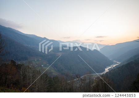 Beautiful sunny landscape of mountains, river and trees in Variaki, Georgia 124443853