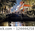 Snow-covered stairs and night cityscape 124444258