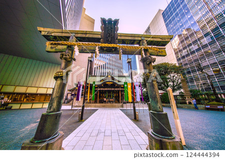 Tokyo cityscape in Japan, with a view of Toranomon-Kotohira Tower and Kotohira Shrine. (Toranomon Hills Station is in the background on the left side of the screen.) 124444394
