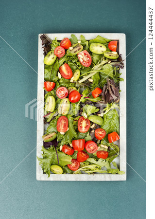 Tomato and lettuce salad. 124444437