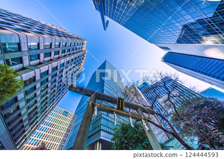 Tokyo cityscape in Japan, with a view of Toranomon-Kotohira Tower and Kotohira Shrine. (Toranomon Hills Station is in the center of the screen.) Tokyo cityscape in Japan, with a view of Toranomon-Kotohira Tower and Kotohira Shrine. (Toranomon Hills Station is in the center of the screen.) 124444593