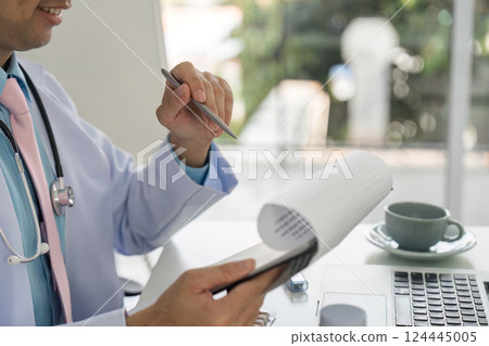 Healthcare Documentation and Medication Management. Doctor reviewing treatment plans while engaging with patients. Healthcare Documentation and Medication Management. Doctor reviewing treatment plans while engaging with patients. 124445005