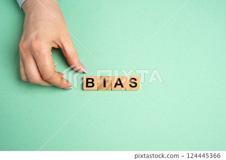 Wooden blocks with the word Bias. Prejudice. Personal opinions. Preconception 124445366