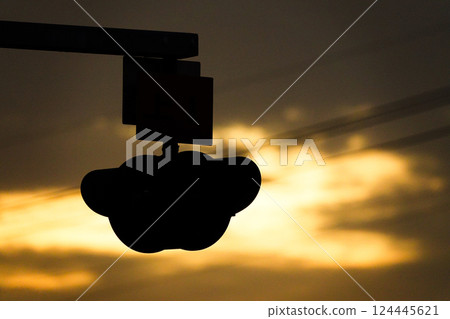 An image of a person waiting for a train at a local station on the Sanin Main Line at dusk 124445621