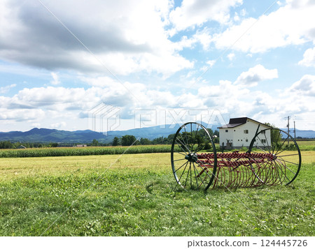 Retro farm equipment blends into the rural landscape Retro farm equipment blends into the rural landscape 124445726