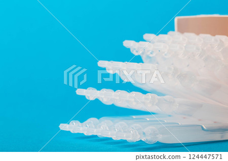 Biologically active food supplement for the gastrointestinal tract on a blue background. Source of succinic acid. Metabiotic of a new generation. Copy space for text Biologically active food supplement for the gastrointestinal tract on a blue background. Source of succinic acid. Metabiotic of a new generation. Copy space for text 124447571