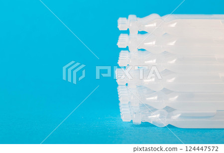 Biologically active food supplement for the gastrointestinal tract on a blue background. Source of succinic acid. Metabiotic of a new generation. Copy space for text Biologically active food supplement for the gastrointestinal tract on a blue background. Source of succinic acid. Metabiotic of a new generation. Copy space for text 124447572