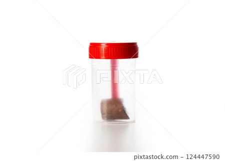 Sterile container with stool test on a white background, isolate, close-up Sterile container with stool test on a white background, isolate, close-up 124447590