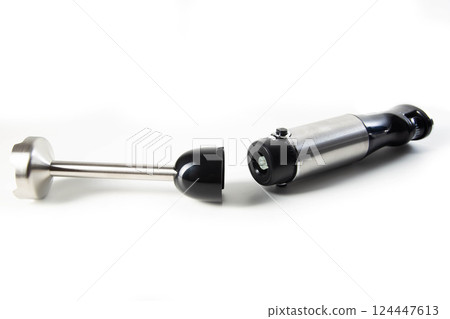 Modern immersion collapsible blender with a chopper on a white background, isolate. Household appliances, close-up Modern immersion collapsible blender with a chopper on a white background, isolate. Household appliances, close-up 124447613