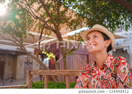 Young female tourist exploring iconic landmarks of the United Arab Emirates. Young female tourist exploring iconic landmarks of the United Arab Emirates. 124448412