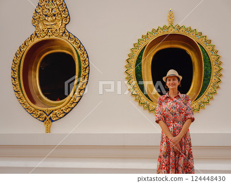 Woman Exploring Colorful Streets Near Buddhist Temples in Bangkok 124448430