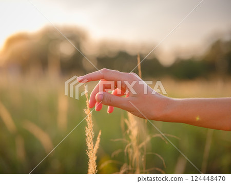 boho chic woman in a floral dress in European countryside boho chic woman in a floral dress in European countryside 124448470