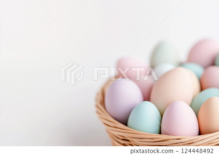 Pastel Easter eggs in baskets on light background 124448492