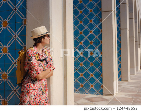 Young female tourist exploring iconic landmarks of the United Arab Emirates. Young female tourist exploring iconic landmarks of the United Arab Emirates. 124448652