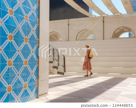 Young female tourist exploring iconic landmarks of the United Arab Emirates. 124448653