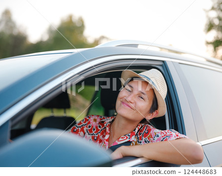Traveler woman drives car through scenic countryside of Croatia 124448683