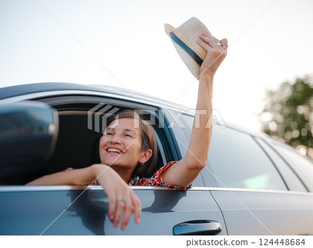 Traveler woman drives car through scenic countryside of Croatia 124448684