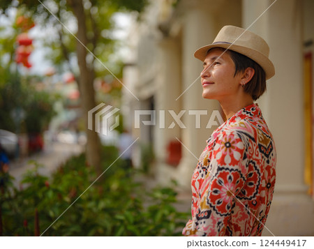 woman exploring streets of George Town, during Chinese New Year. woman exploring streets of George Town, during Chinese New Year. 124449417