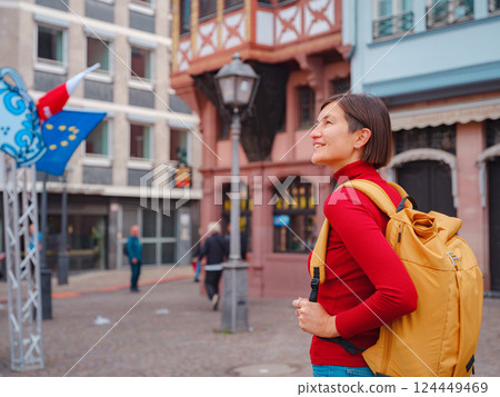 woman walks through old town of Frankfurt woman walks through old town of Frankfurt 124449469
