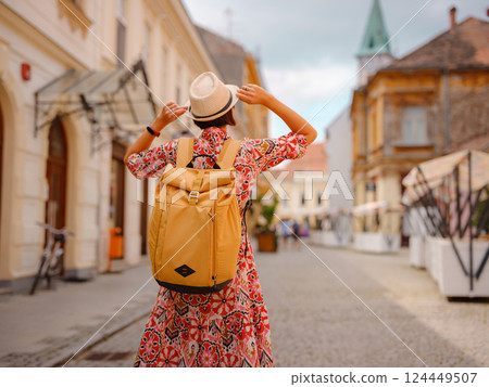 Woman Walking Through the Historic Center of Varazdin 124449507