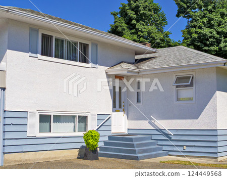 A perfect neighbourhood. Door steps and decorative flower in front of residential house entrance A perfect neighbourhood. Door steps and decorative flower in front of residential house entrance 124449568