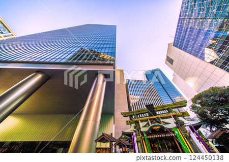Tokyo cityscape in Japan, with a view of Toranomon-Kotohira Tower and Kotohira Shrine. (Toranomon Hills Station is in the background on the left side of the screen.) 124450138