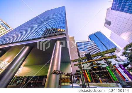 Tokyo cityscape in Japan, with a view of Toranomon-Kotohira Tower and Kotohira Shrine. (Toranomon Hills Station is in the background on the left side of the screen.) 124450144