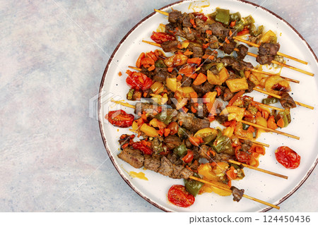 Juicy lamb kebab with vegetables 124450436