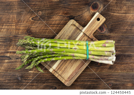 Delicious raw green asparagus. 124450445