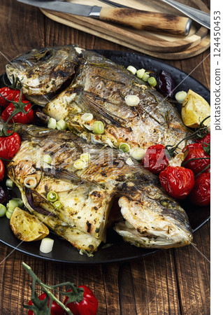 Grilled sea bream or dorada. 124450453