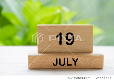 July 19th calendar text on wooden blocks with customizable space for text. Calendar concept. 124451345