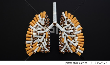 Artistic representation of human lungs made from cigarettes, symbolizing the health risks of smoking and its impact on respiratory health. Artistic representation of human lungs made from cigarettes, symbolizing the health risks of smoking and its impact on respiratory health. 124452373